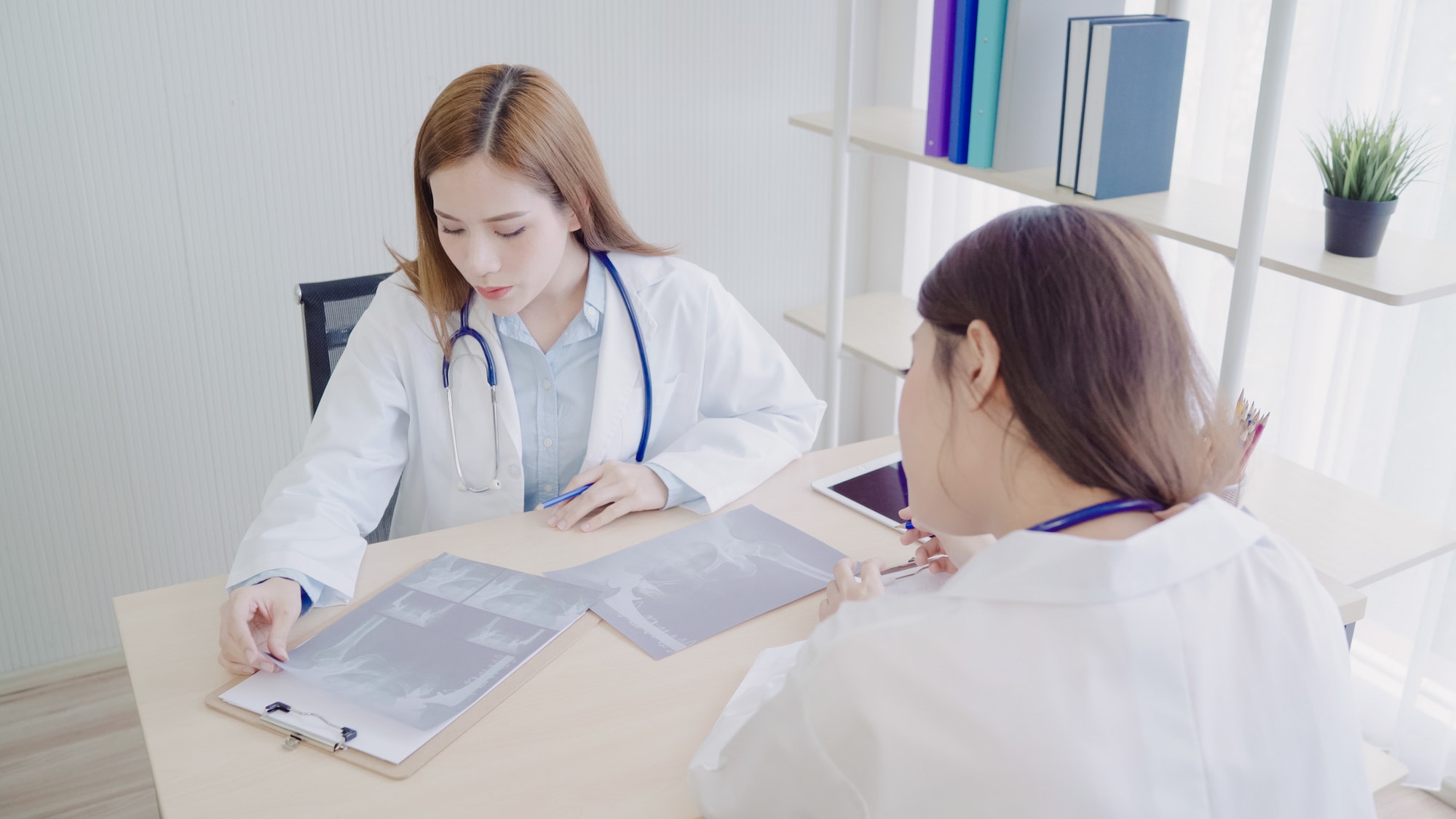 Professional Asian doctor medical professionals team brainstorming in a meeting.